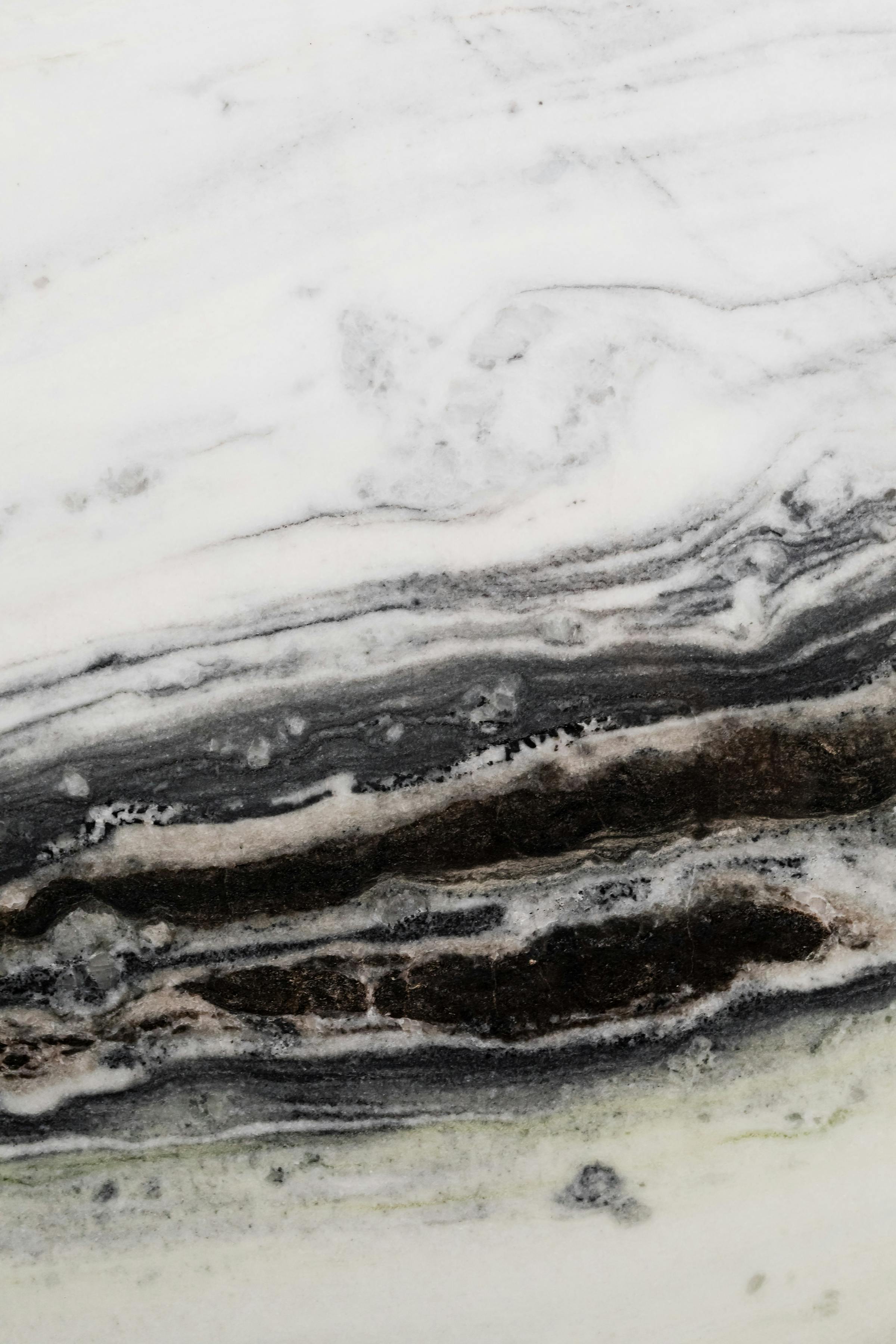 Close view of a polished marble slab with natural veining